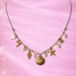 collier océanique doré coquillage et étoiles